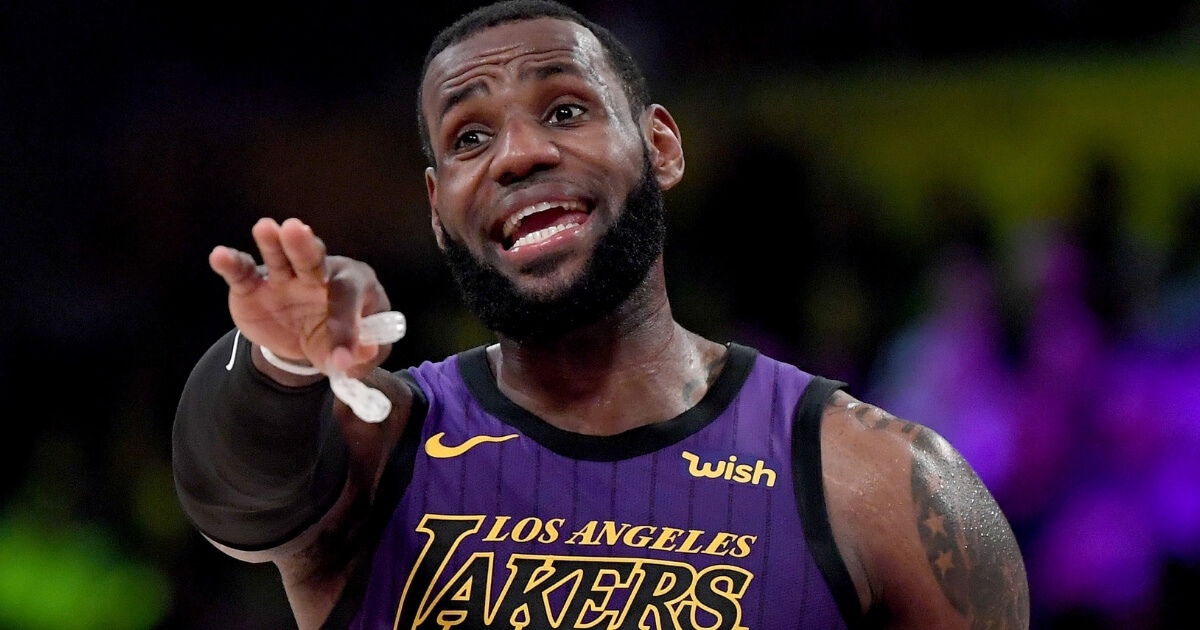 LeBron James of the Los Angeles Lakers directs the offense during a 112-104 Laker win over the New Orleans Pelicans at Staples Center on Dec. 21, 2018 in Los Angeles, California.