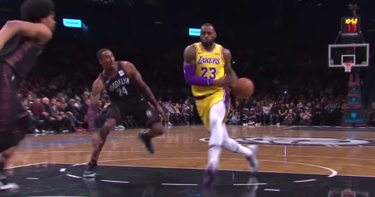 The Los Angeles Lakers' LeBron James goes up for a dunk against Brooklyn -- and is rejected.