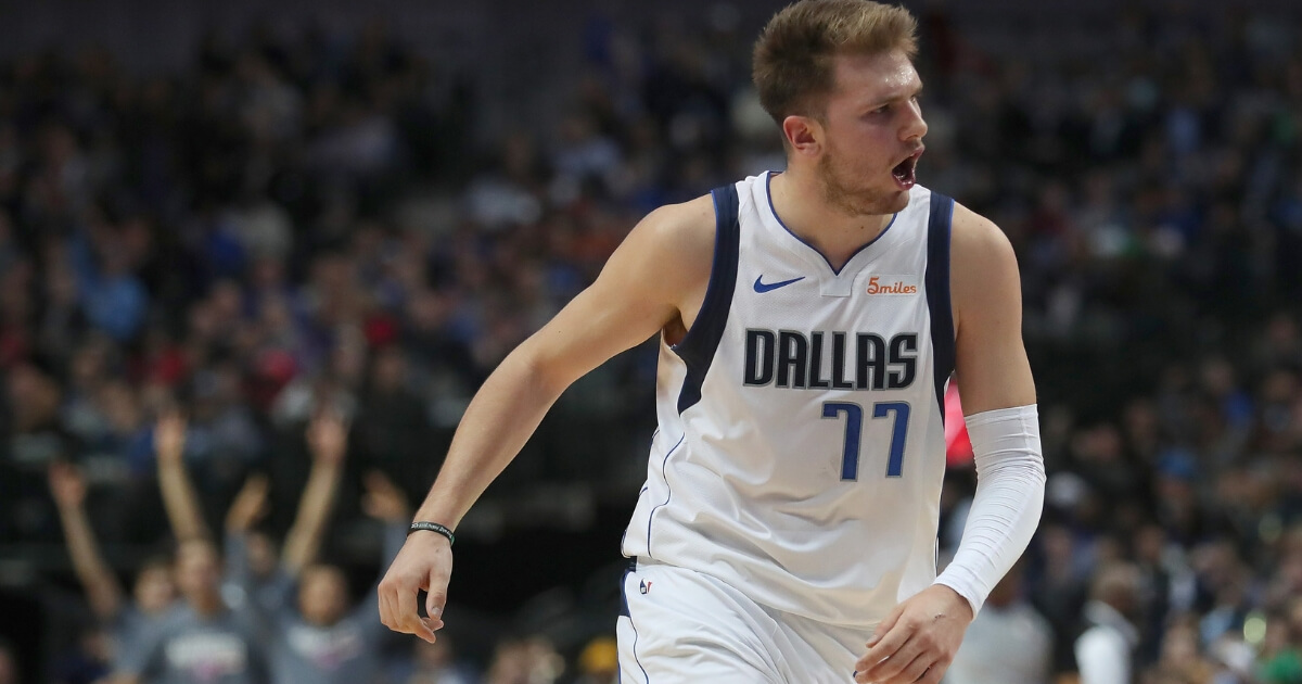 Dallas' Luka Doncic scored 11 consecutive points late in his team's win Saturday over Houston.