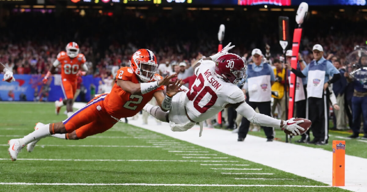 Mack Wilson #30 of the Alabama Crimson Tide scores a touchdown on an interception as Kelly Bryant #2 of the Clemson Tigers defends in the second half of the AllState Sugar Bowl at the Mercedes-Benz Superdome on January 1, 2018 in New Orleans, Louisiana. (Photo by Tom Pennington/Getty Images)