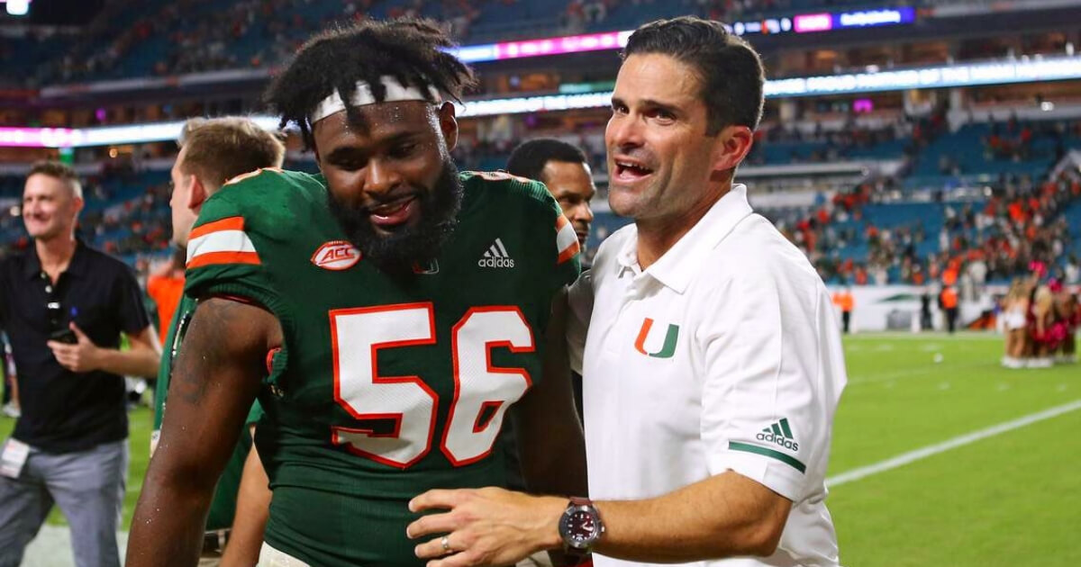 New Miami head football coach Manny Diaz, right, with junior linebacker Michael Pinckney, who announced he's forgoing the NFL draft to play for Diaz in 2019.