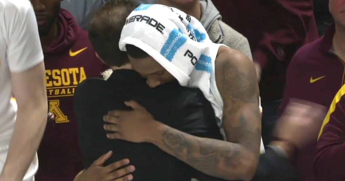 Minnesota Golden Gophers guard Dupree McBrayer, whose mother died of cancer Monday, hugs coach Richard Pitino after the game Wednesday.