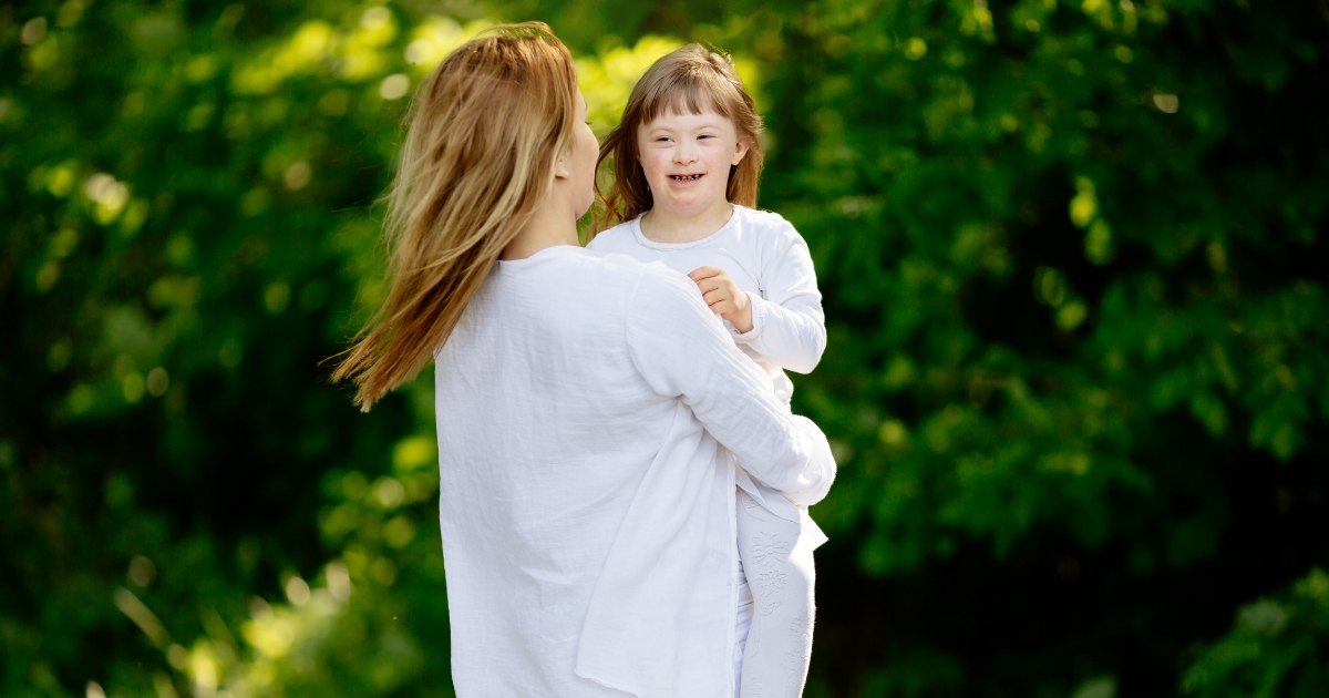 Mother with her daughter with Down syndrome.