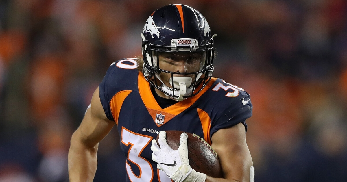 Phillip Lindsay of the Denver Broncos carries the ball against the Cleveland Browns at Broncos Stadium at Mile High on Dec. 15.