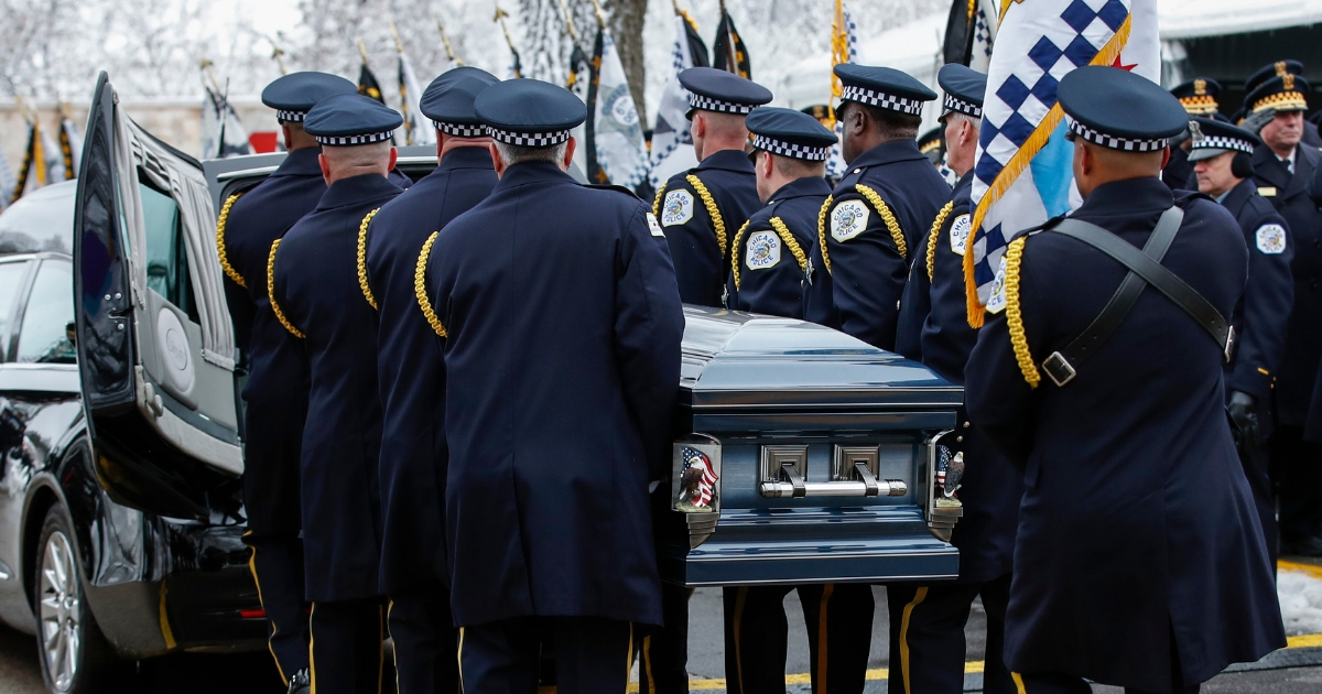 An honor guard carries the casket of slain Chicago Police Officer Samuel Jimenez to the hearse following services at the Chapel of St Joseph at Shrine of Our Lady of Guadalupe on Nov. 26 in Des Plaines, Illinois.