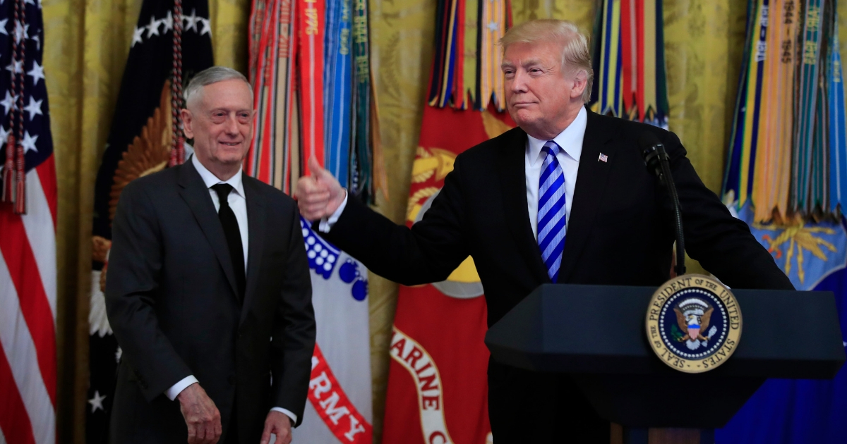 President Donald Trump with Defense Secretary Jim Mattis gestures during a reception commemorating the 35th anniversary of the attack on Beirut Barracks in the East Room at the White House in Washington, Oct. 25, 2018.
