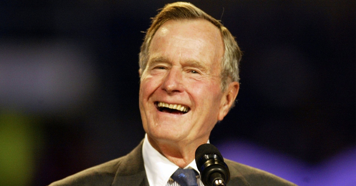 Former President George H.W. Bush speaks during the Billy Graham Crusade at Texas Stadium in 2002.