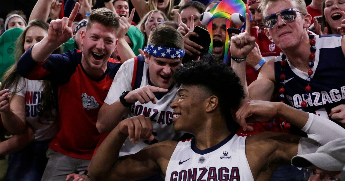 Gonzaga forward Rui Hachimura celebrates with fans after his team defeated Washington 81-79 on Wednesday.