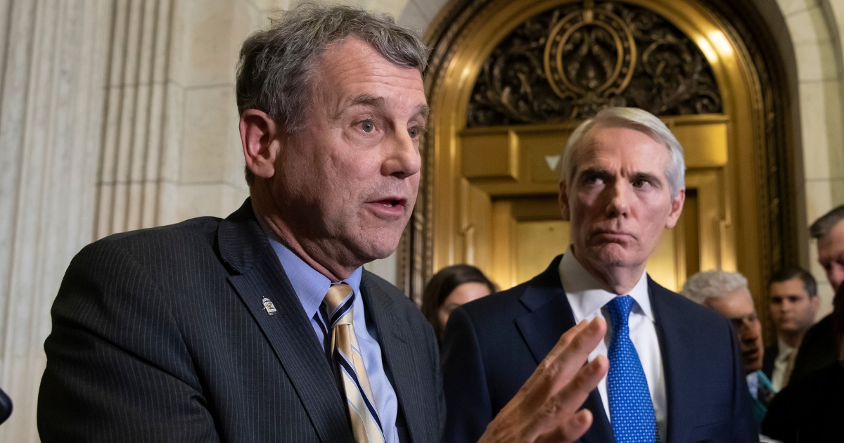 Sen. Sherrod Brown, D-Ohio, and Sen. Rob Portman, R-Ohio, speak to reporters after a meeting with General Motors CEO Mary Barra to discuss GM's announcement it would stop making the Chevy Cruze at its Lordstown, Ohio, plant, part of a massive restructuring for the Detroit-based automaker, on Capitol Hill in Washington, Dec. 5, 2018.