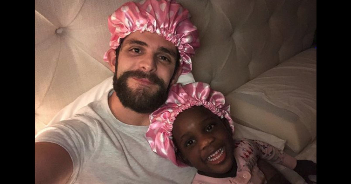 Thomas Rhett with his adopted daughter