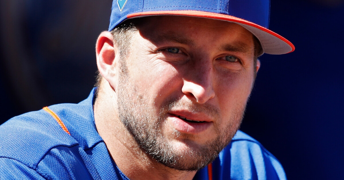 Tim Tebow looks on before a New York Mets spring training game in February.