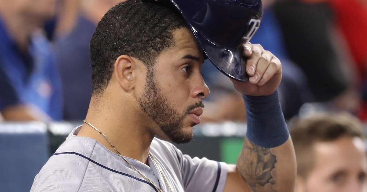 Tommy Pham of the Tampa Bay Rays puts on his helmet as he gets ready to bat in a Sept. 3 game against the Toronto Blue Jays at Rogers Centre.