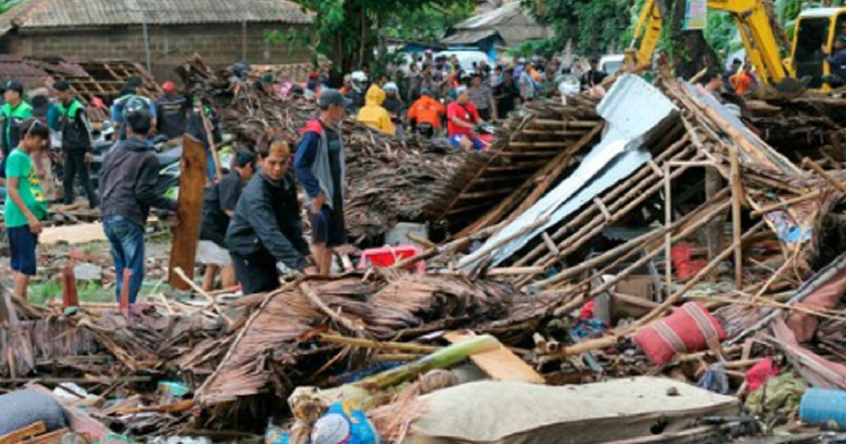 Survivors confront the wreckage from a tsunami that swept ashore in Indonesia on Saturday, killing more than 200 people.