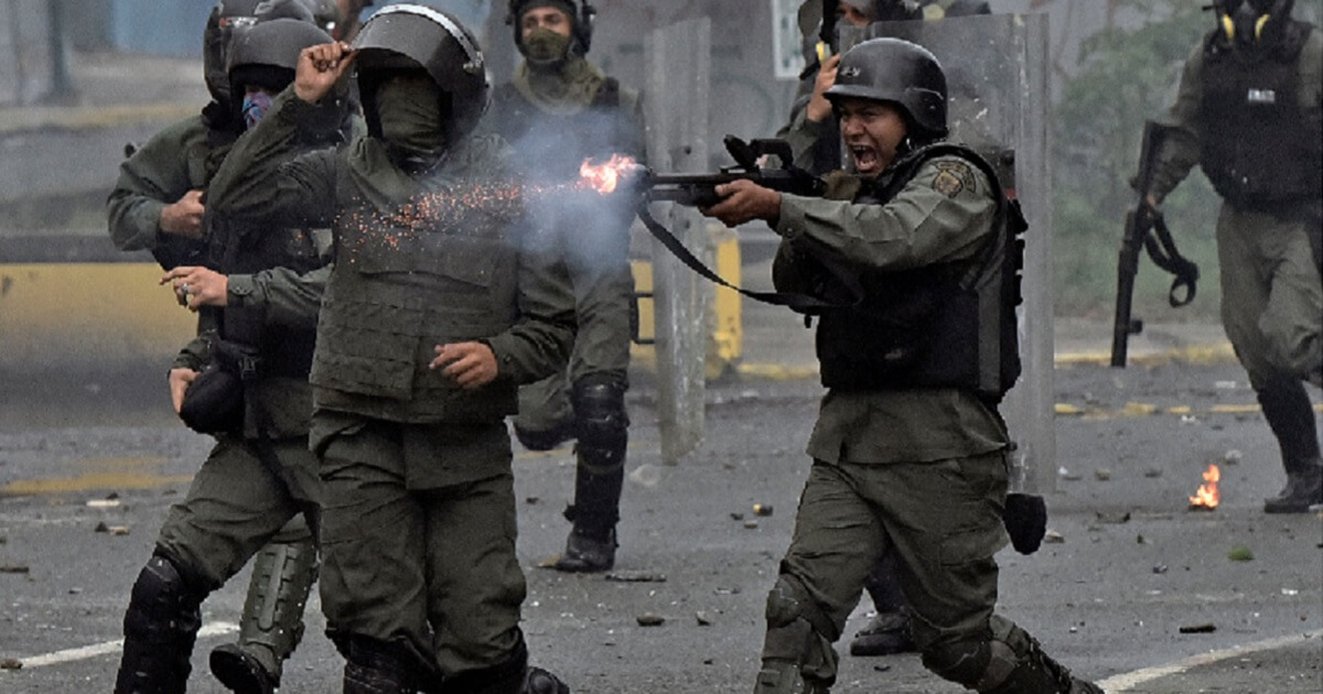 Venezuelan security forces fire on protesters during a demonstration in the capital of Caracas in July 2017.