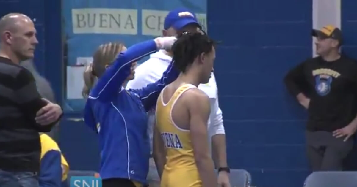 A referee made New Jersey high school wrestler Andrew Johnson choose between cutting his dreadlocks or forfeiting his match. He chose the haircut.