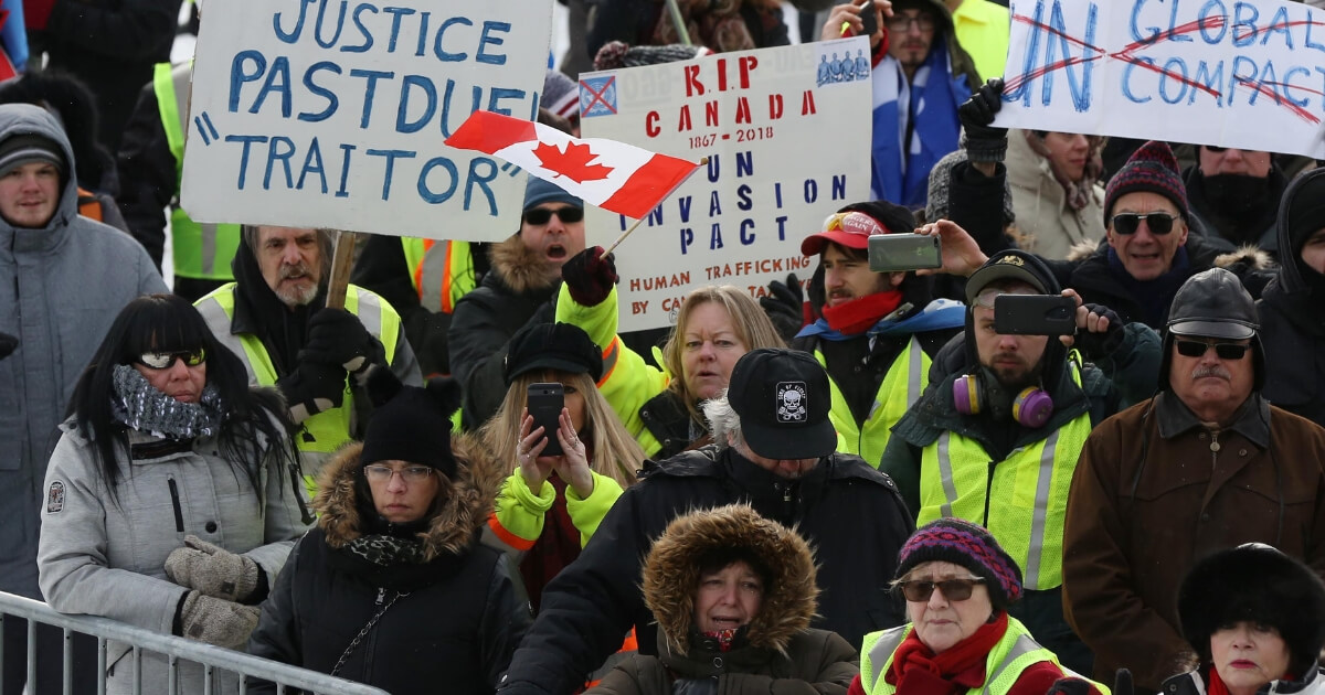 Canadians, many in yellow vests like those worn by anti-government protesters in France, demonstrate in Ottawa on Dec. 8.