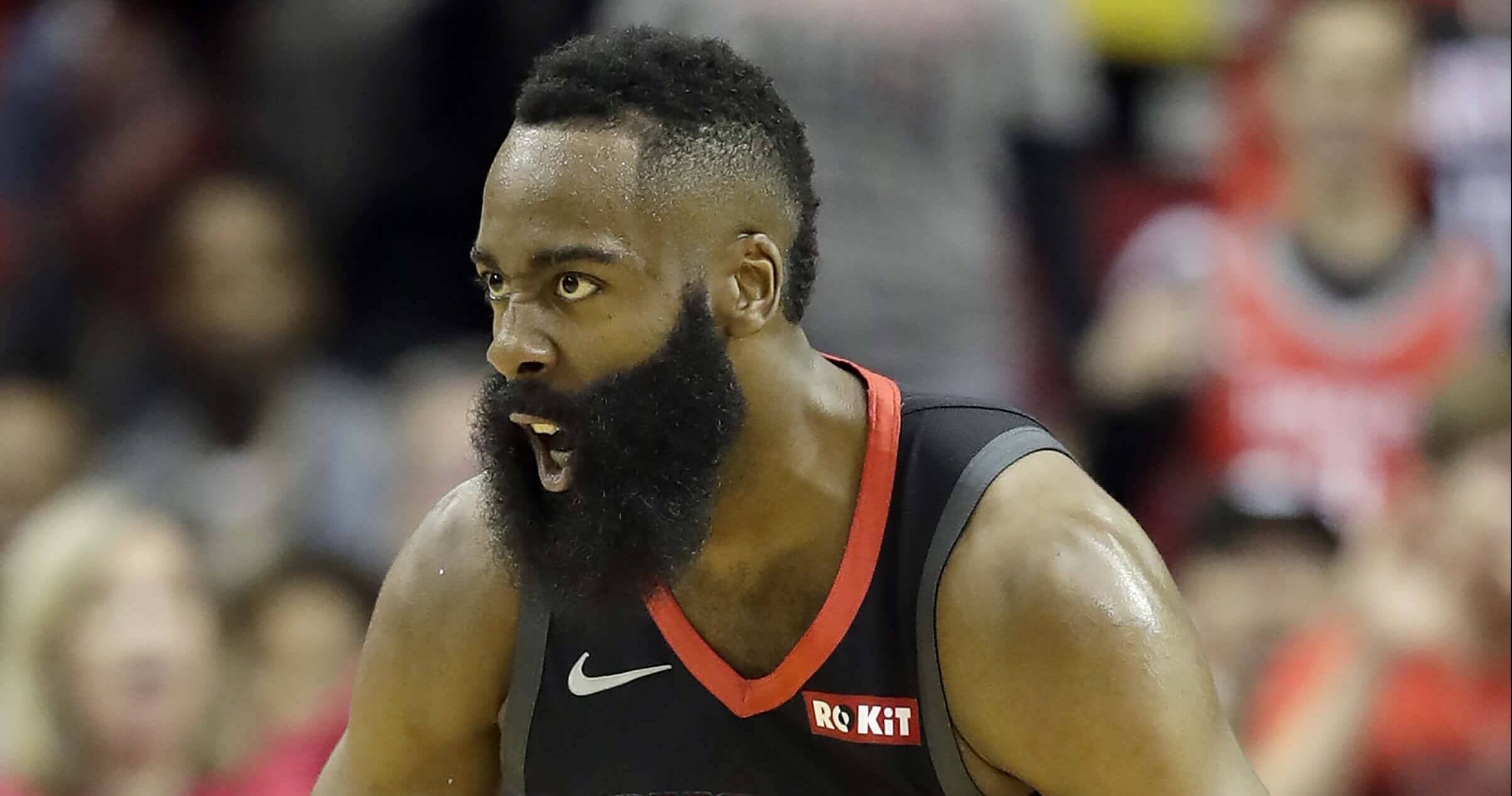 Houston Rockets' James Harden reacts after dunking the ball against the Los Angeles Lakers in the first half Thursday in Houston.
