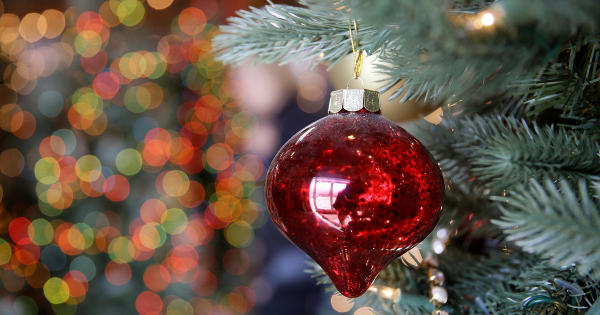 In this Nov. 30, 2018, photo, an ornament hangs on an artificial Christmas tree at the Balsam Hill Outlet store in Burlingame, California.