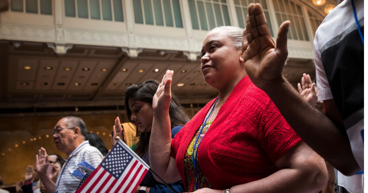 New U.S. citizens recite the Oath of Allegiance during naturalization ceremony at the New York Public Library, July 3, 2018 in New York City.