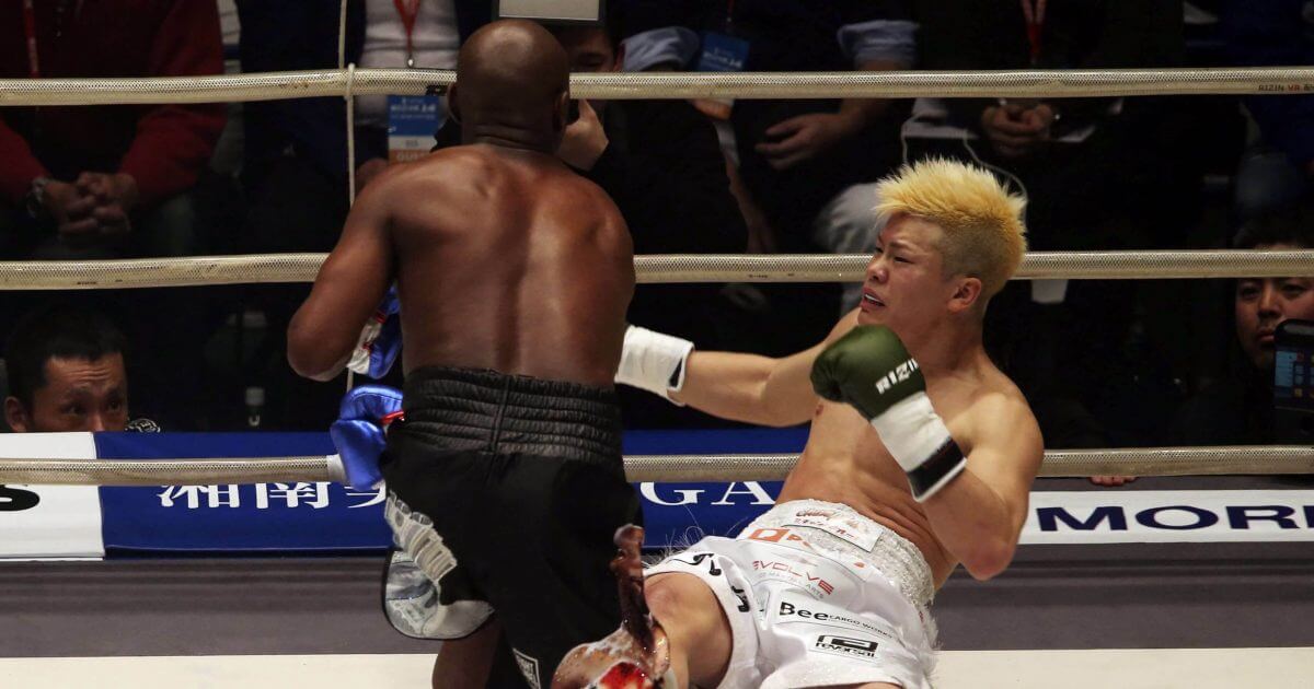 Japanese kickboxer Tenshin Nasukawa lies on the mat after being knocked out by Floyd Mayweather Jr. during first round of their three-round exhibition match on New Year's Eve, at Saitama Super Arena in Saitama, north of Tokyo, on Dec. 31, 2018.