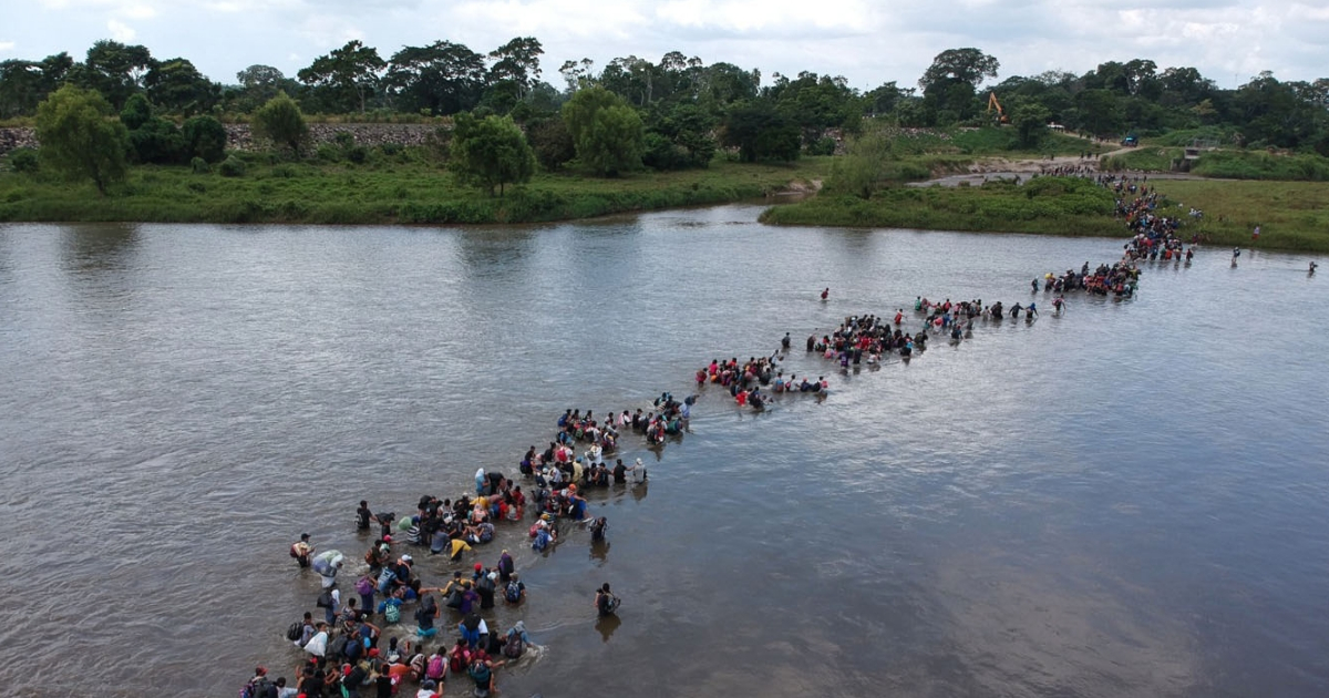 Aerial view of Salvadorean migrants heading in a caravan to the U.S., crossing the Suchiate River to Mexico, from Ciudad Tecun Uman, Guatemala, on Nov. 2, 2018.
