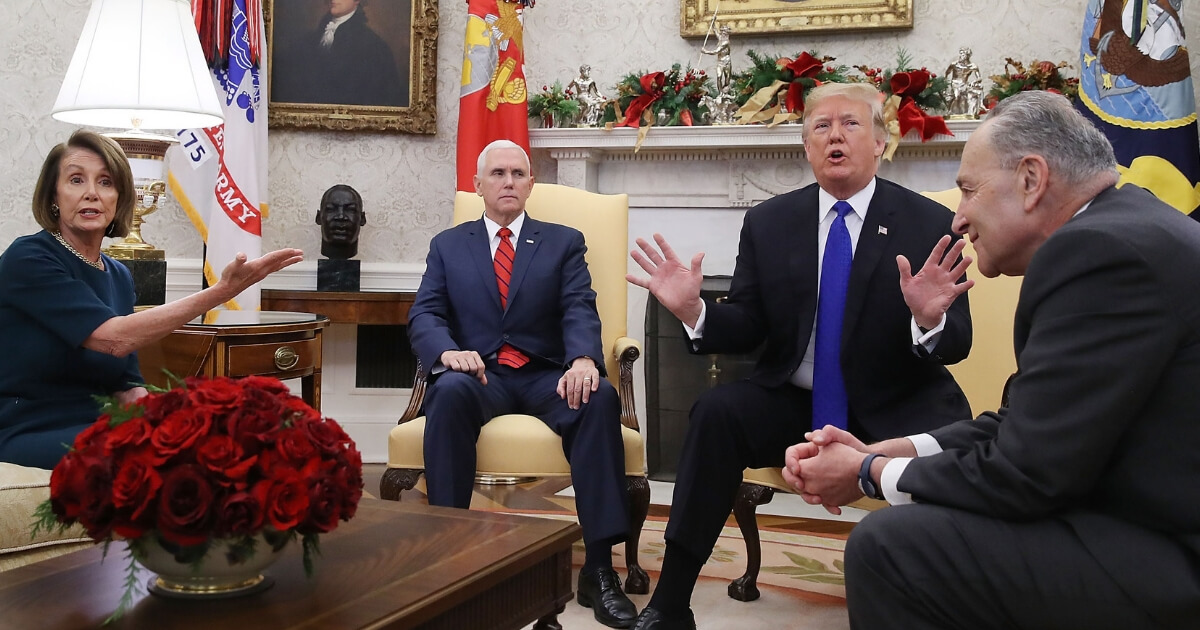 President Donald Trump argues about border security with Senate Minority Leader Chuck Schumer and House Minority Leader Nancy Pelosi as Vice President Mike Pence sits nearby in the Oval Office.