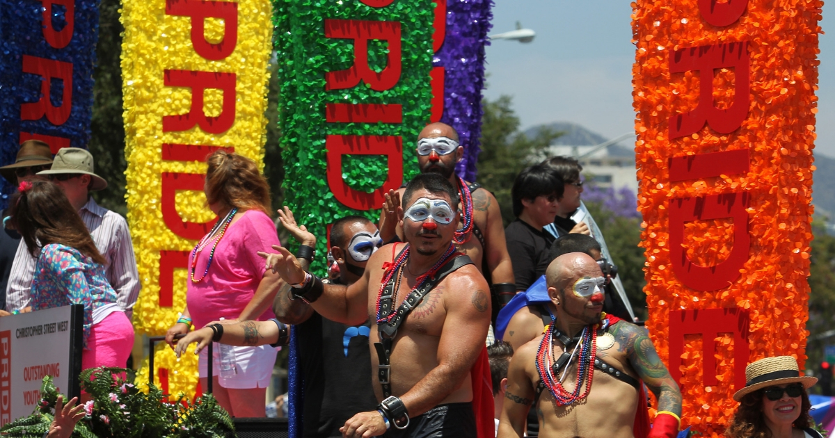 People ride on a float in the L.A. Pride Parade in West Hollywood, California.