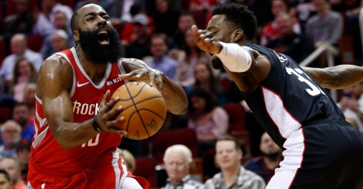 The Houston Rockets' James Harden drives past the Washington Wizards' Jeff Green during Wednesday's game in Houston.