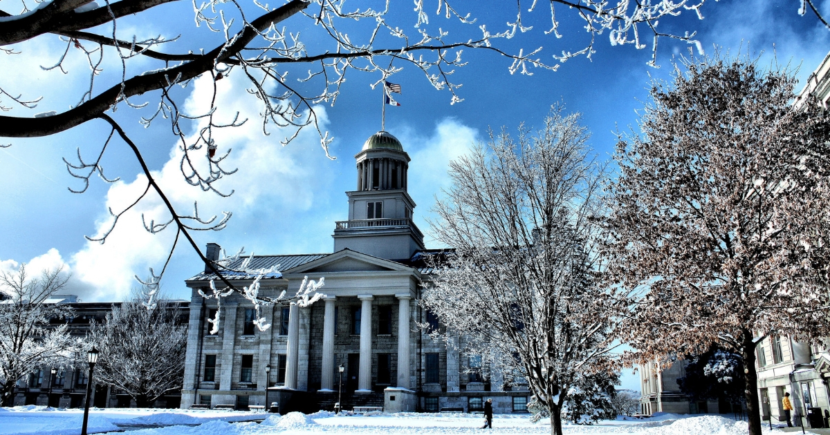 The Old Capitol and Pentacrest at the University of Iowa covered in ice and snow.