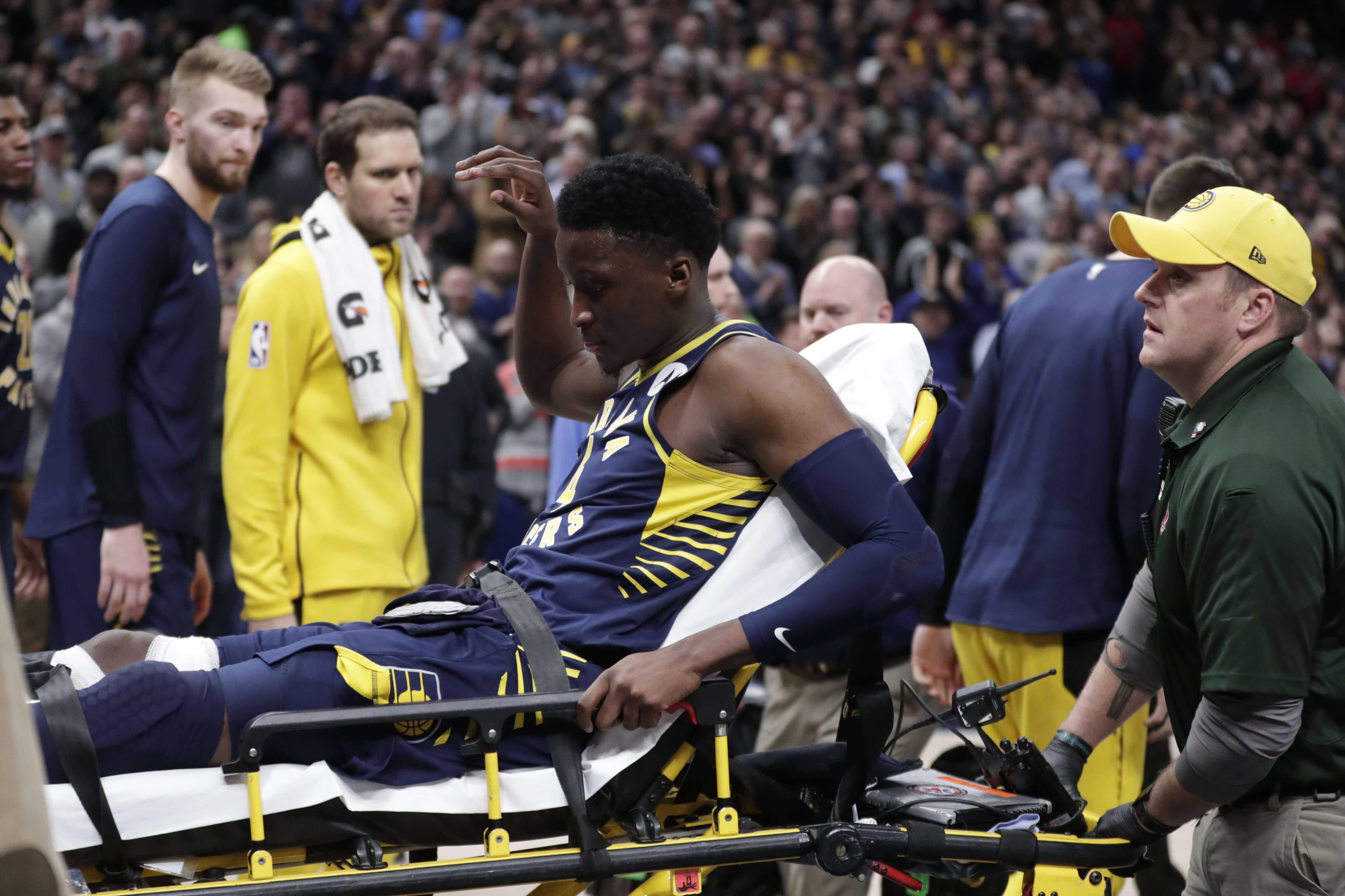 Indiana Pacers guard Victor Oladipo is taken off the court on a stretcher after he was injured during the first half of the team's game against the Toronto Raptors in Indianapolis on Wednesday.