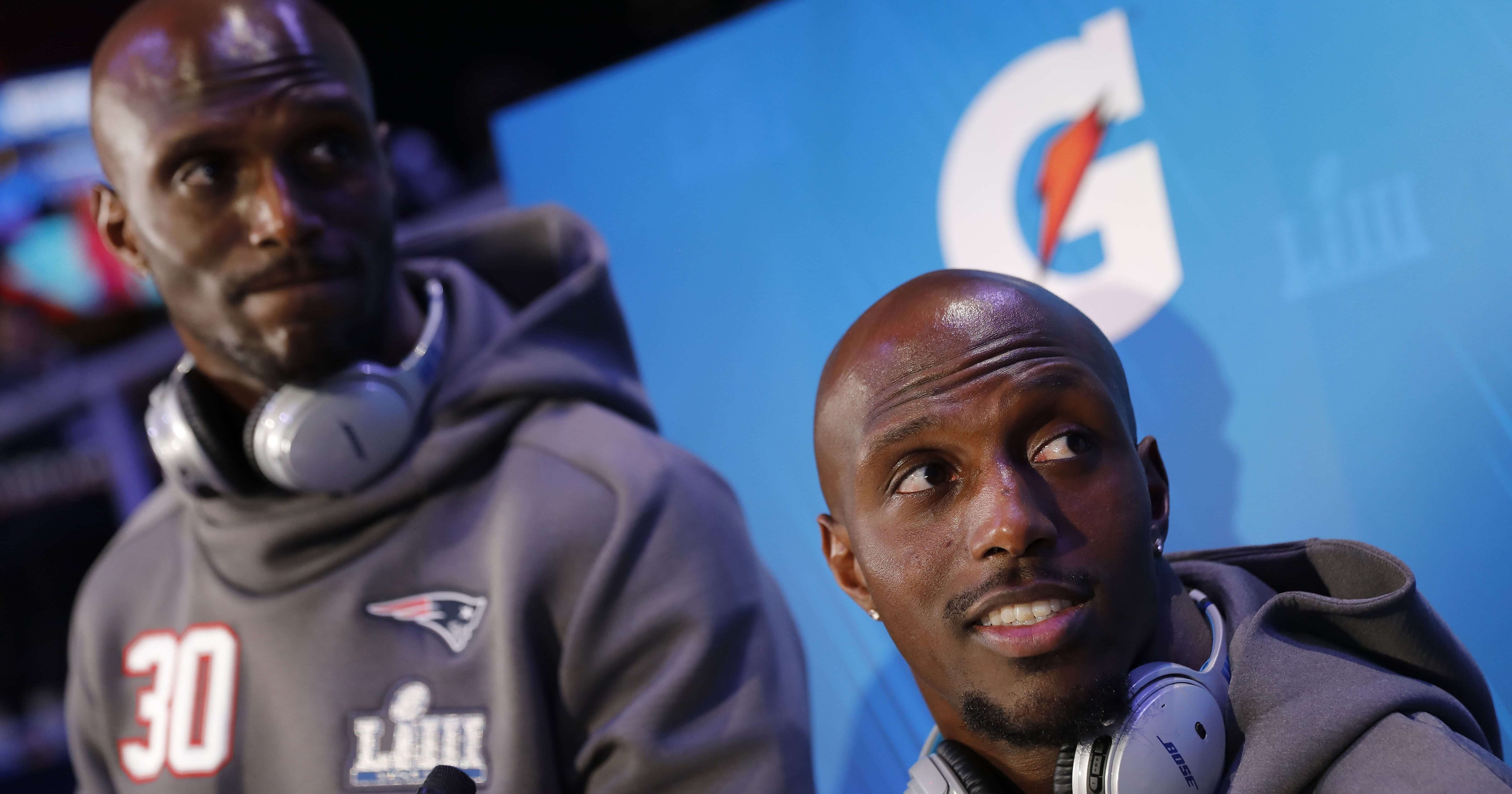 The New England Patriots' Jason McCourty, left, and Devin McCourty answer questions during Super Bowl LIII Opening Night on Monday in Atlanta.