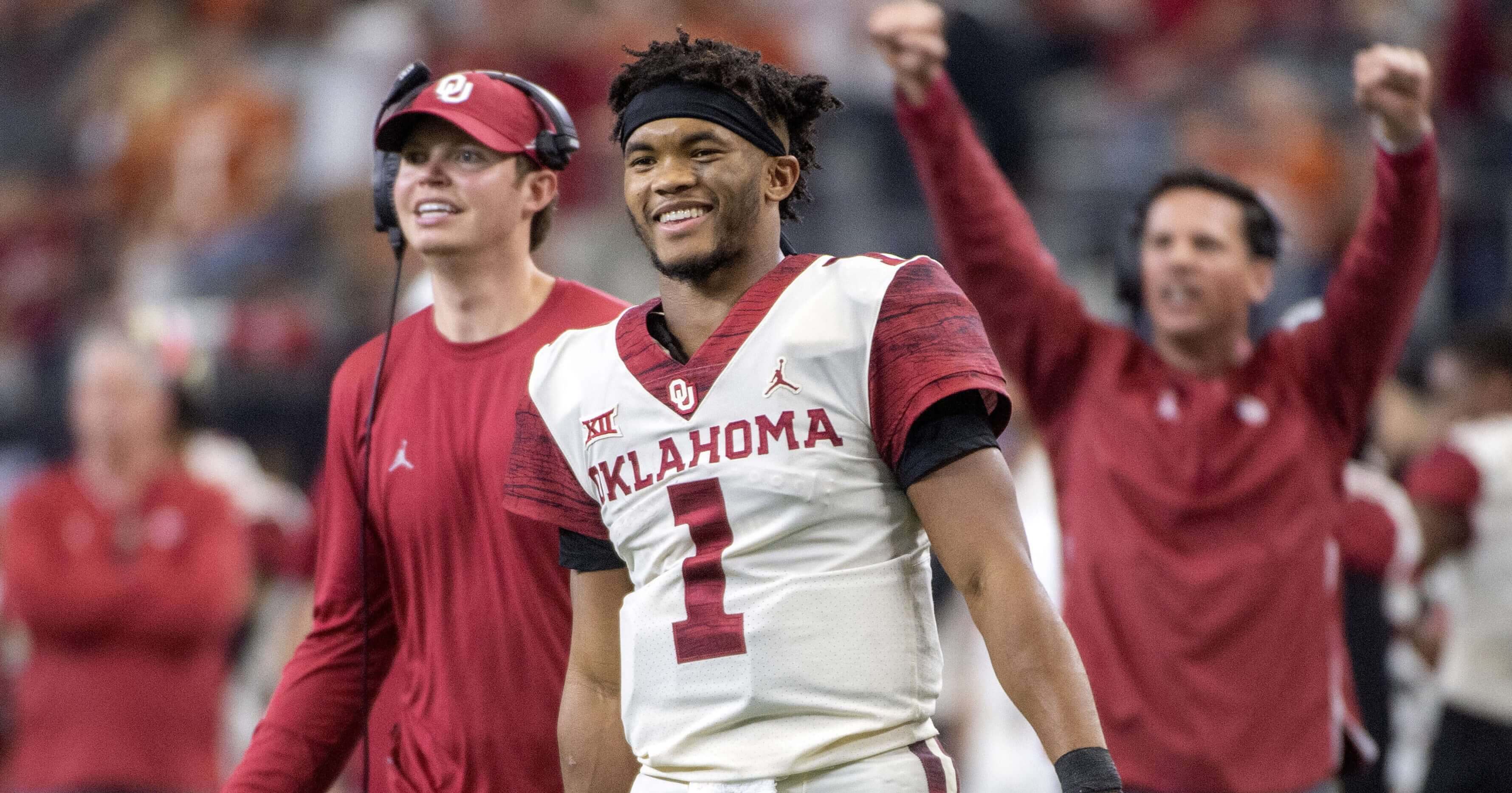 Oklahoma quarterback Kyler Murray celebrates on the sidelines after throwing a touchdown pass against Texas in the Big 12 championship game. Murray is one of a record number of college football players bypassing their remaining years of eligibility to enter the NFL draft.