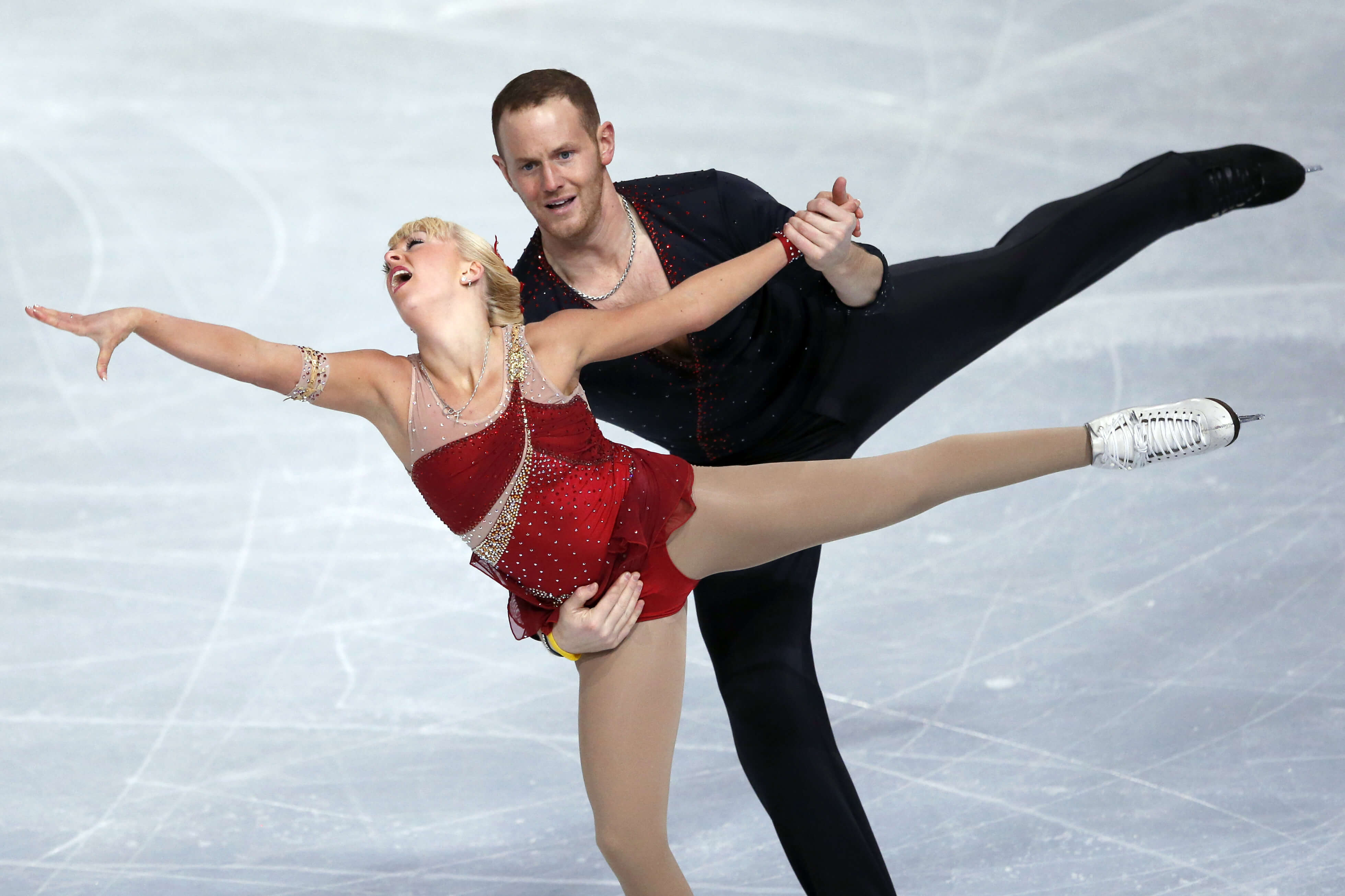 Caydee Denney and John Coughlin perform during their pairs short program during the ISU Figure Skating Eric Bompard Trophy at Bercy arena in Paris on Nov. 15, 2013.