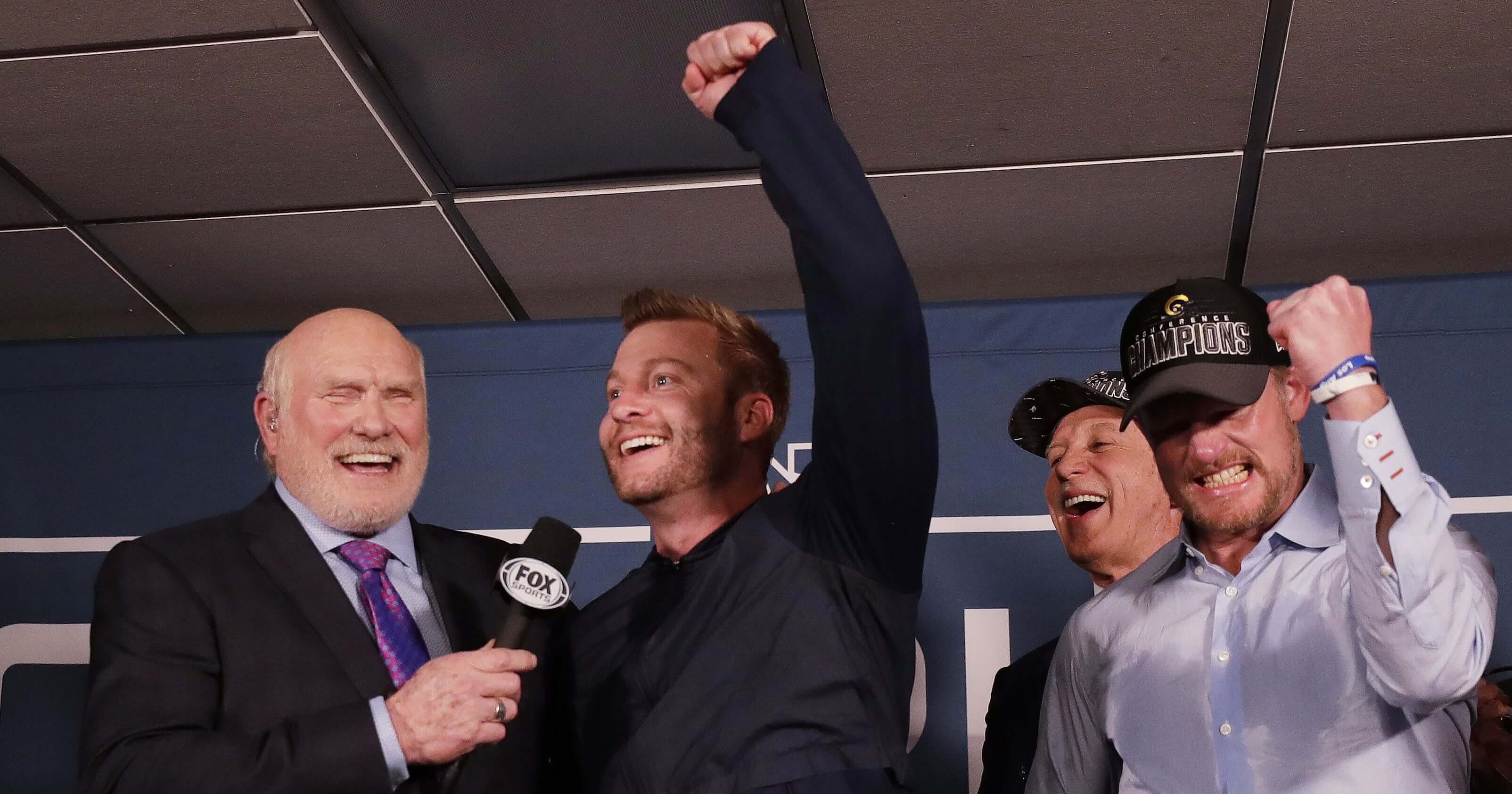 Los Angeles Rams head coach Sean McVay reacts in the locker room with broadcaster Terry Bradshaw after his team's overtime victory over the New Orleans Saints in the NFC championship game Sunday.