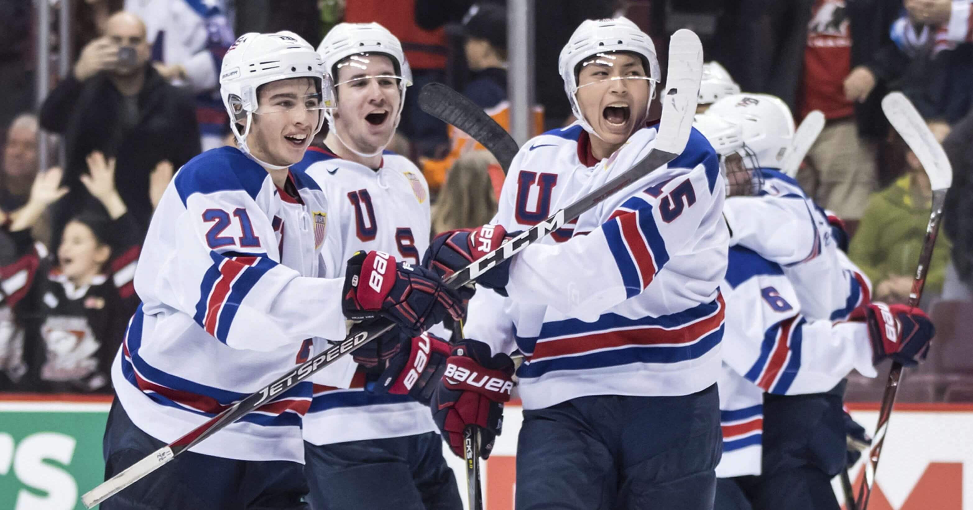 USA Hockey players Noah Cates, Mattias Samuelsson and Jason Robertson, from left, celebrate after defeating Russia in a world junior hockey championships semifinal in Vancouver, British Columbia, on Friday.