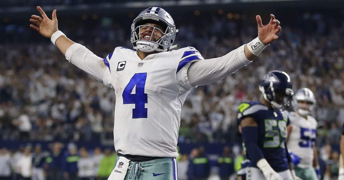 Dallas Cowboys quarterback Dak Prescott (4) celebrates his first down near the goal line against the Seattle Seahawks during the second half of the NFC wild-card NFL football game in Arlington, Texas on Saturday.
