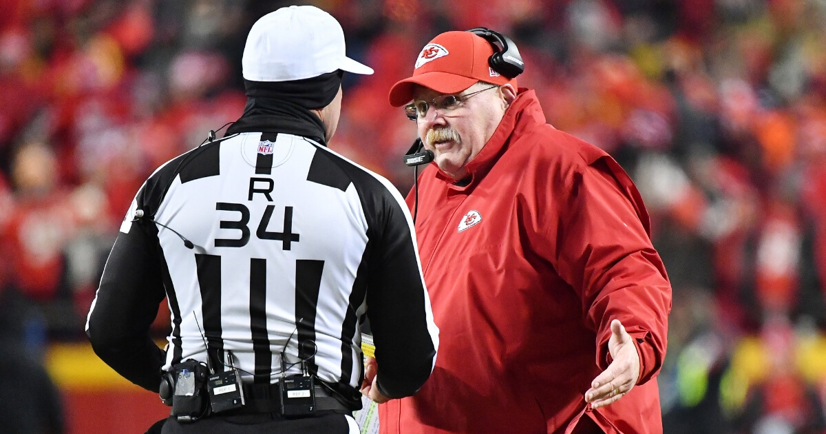 Kansas City Chiefs coach Andy Reid speaks to referee Clete Blakeman after a call in the fourth quarter against the New England Patriots during the AFC championship game Sunday at Arrowhead Stadium.