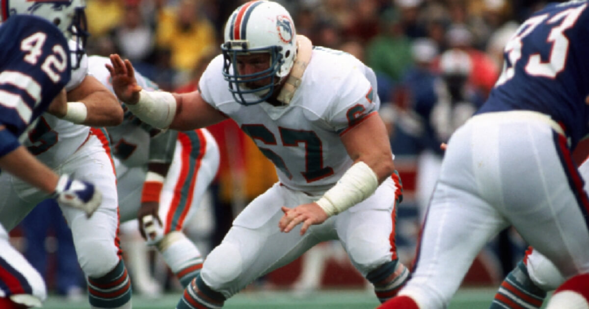 Offensive lineman Bob Kuechenberg #67 of the Miami Dolphins blocks against the Buffalo Bills at Rich Stadium on Nov. 21, 1982 in Orchard Park, New York. Kuechenberg died Saturday athe age of 71.