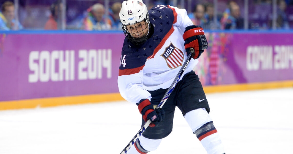 Brianna Decker of the United States handles the puck against Canada during the Ice Hockey Women's Gold Medal Game on day 13 of the Sochi 2014 Winter Olympics at Bolshoy Ice Dome on Feb. 20, 2014 in Sochi, Russia.