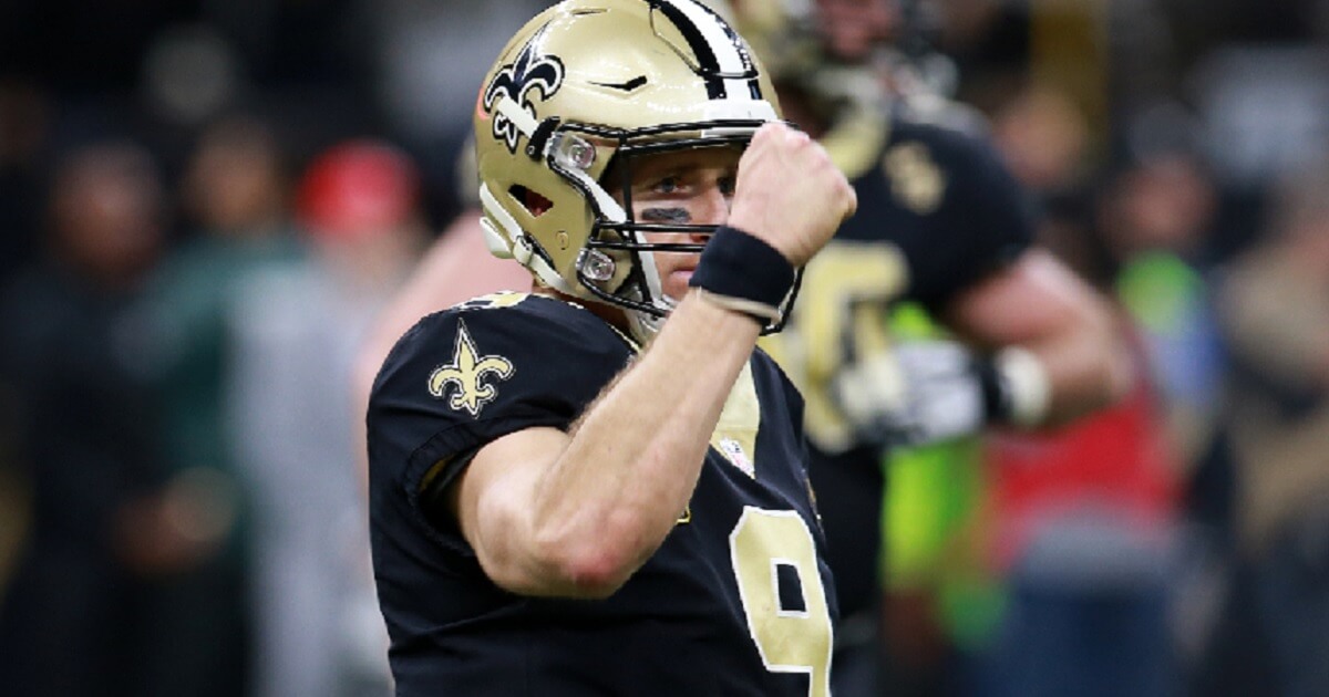 New Orleans Saints quarterback Drew Brees pumps a fist after the Saints' first touchdown in the Divisional Round playoff game against the Philadelphia Eagles.