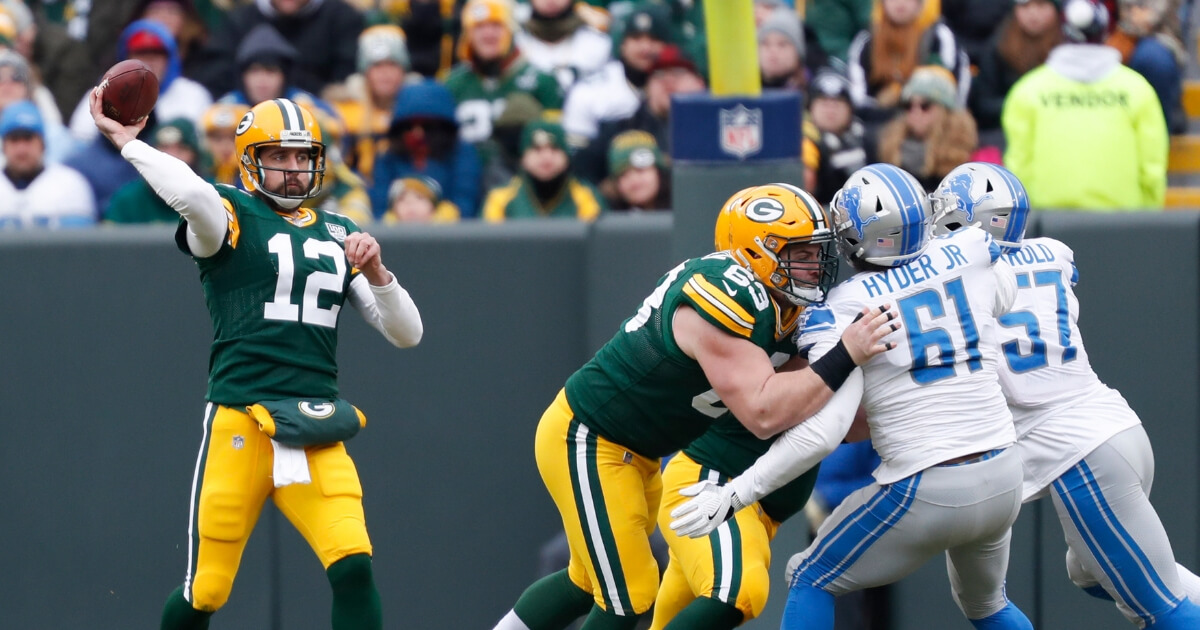 Green Bay Packers' Aaron Rodgers throws during the first half of an NFL football game against the Detroit Lions on Dec. 30, 2018, in Green Bay, Wisconsin.