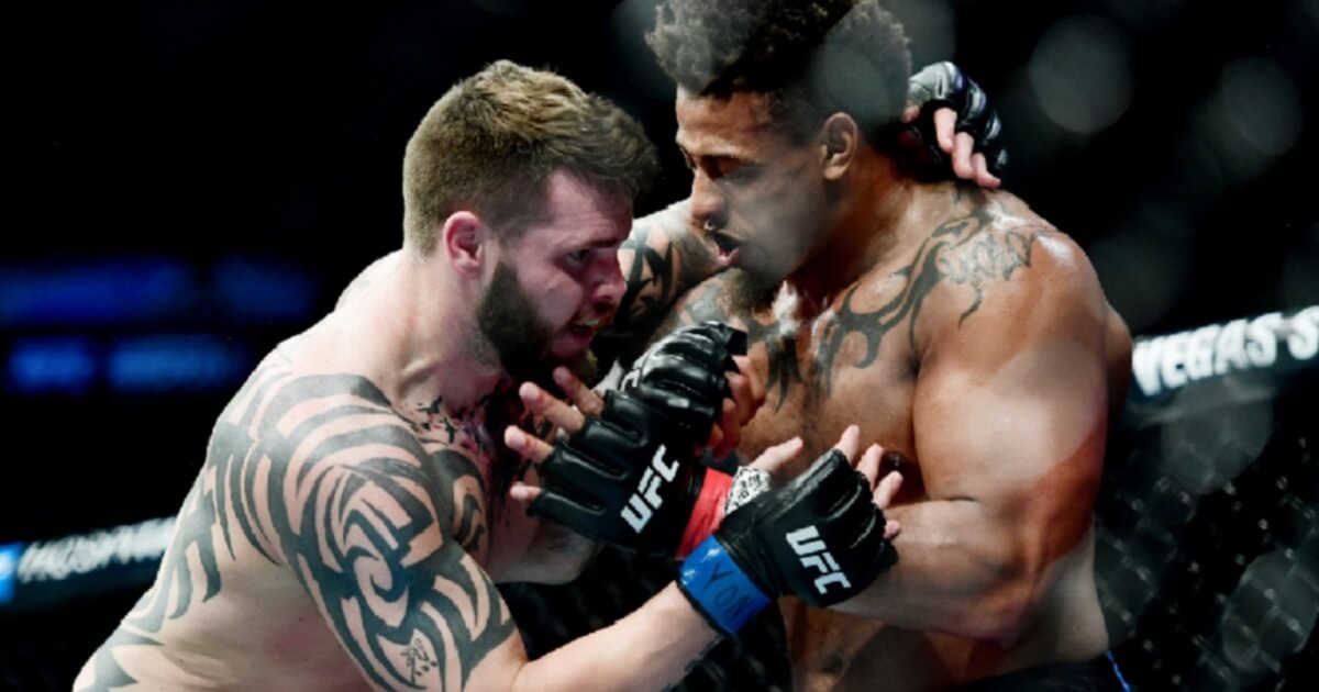 Greg Hardy, right, fights Allen Crowder during a heavyweight bout at Saturday's UFC Fight Night at Barclays Center in New City.