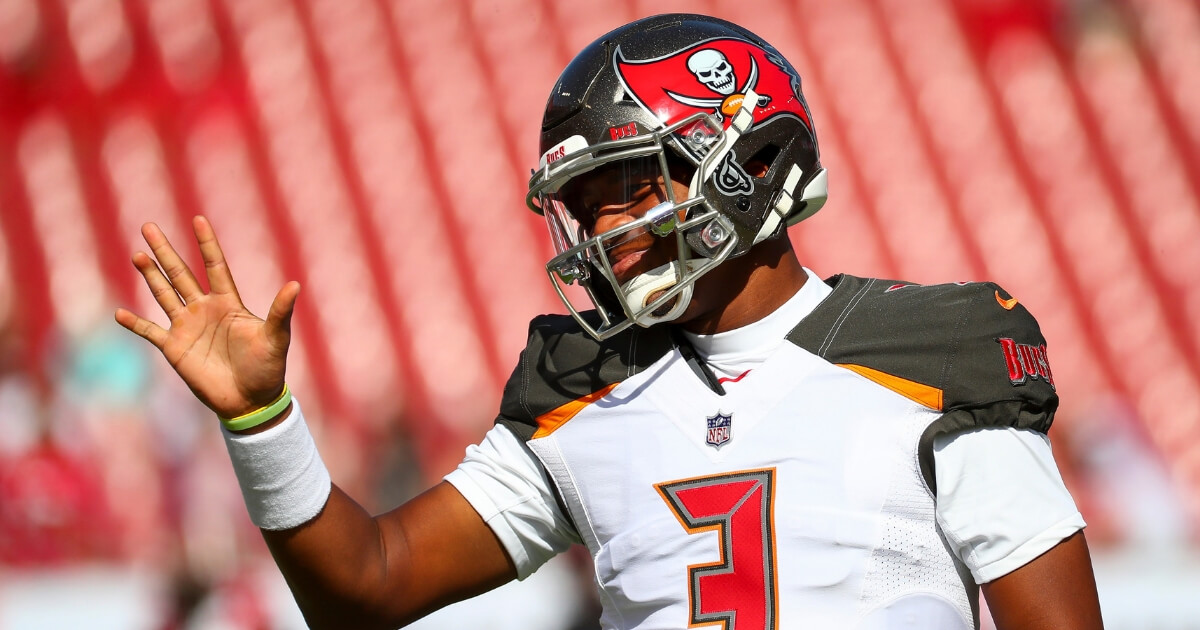 Quarterback Jameis Winston of the Tampa Bay Buccaneers waves to a fan during warmups before a Nov. 25 game against the San Francisco 49ers at Raymond James Stadium.