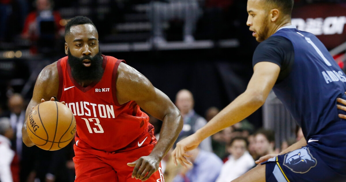 James Harden of the Houston Rockets drives around Kyle Anderson of the Memphis Grizzlies during Monday's game at Toyota Center.