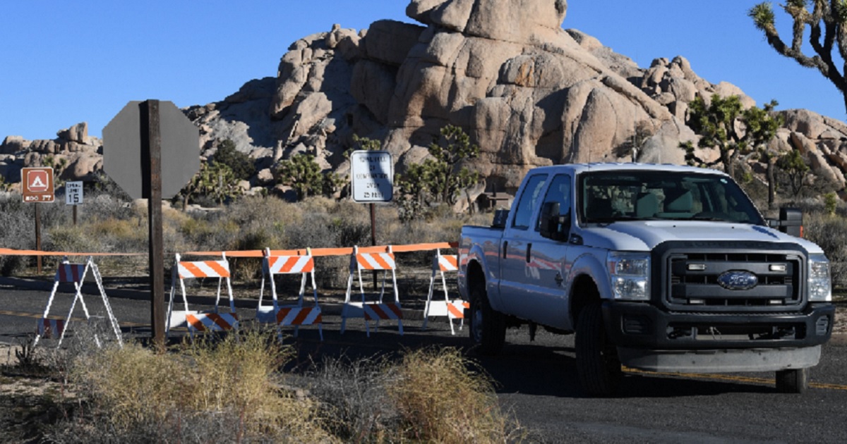 A National Partk Service truck and barricades block a road in California's Joshua Tree National Park during the partial government shutdown.
