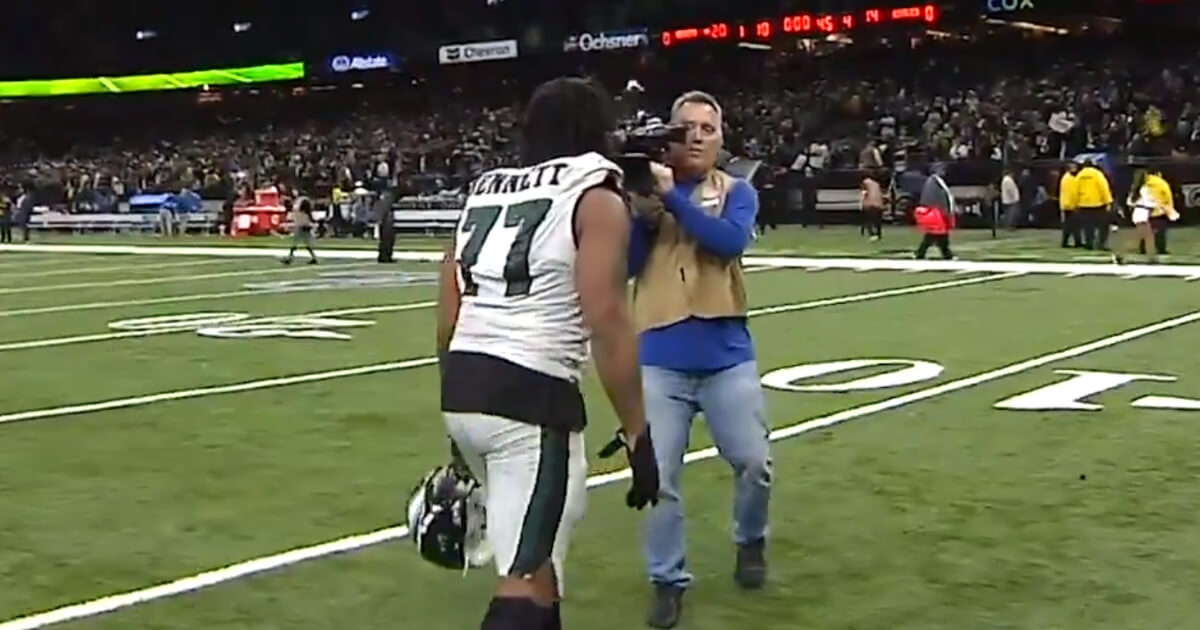 Philadelphia Eagles defensive end Michael Bennett confronts a cameraman as he walks off the field following a playoff loss to the New Orleans Saints.