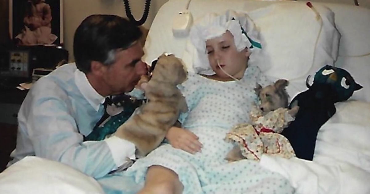 Mr. Rogers puts on a puppet show for a girl in the hospital