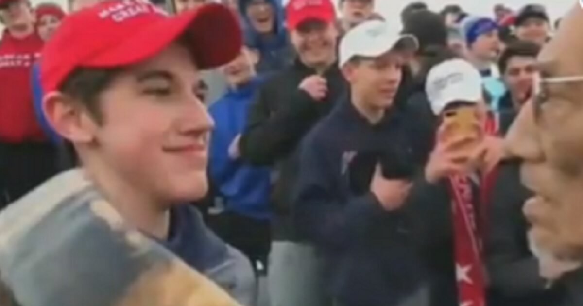High school student Nick Sandmann faced off with Native American activist Nathan Phillips in a confrontation Friday near the Lincoln Memorial in Washington.