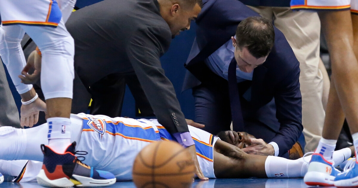 Oklahoma City Thunder forward Nerlens Noel is attended to after an injury during the second half of Tuesday's game against the Minnesota Timberwolves in Oklahoma City.