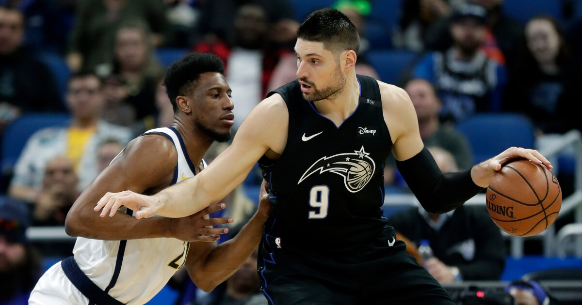 Orlando Magic's Nikola Vucevic looks for a way to the basket against the Indiana Pacers' Thaddeus Young during a game Thursday in Orlando, Florida. Vucevic is one of four first-time NBA All-Stars and the first Magic player to make the game since Dwight Howard in 2012.